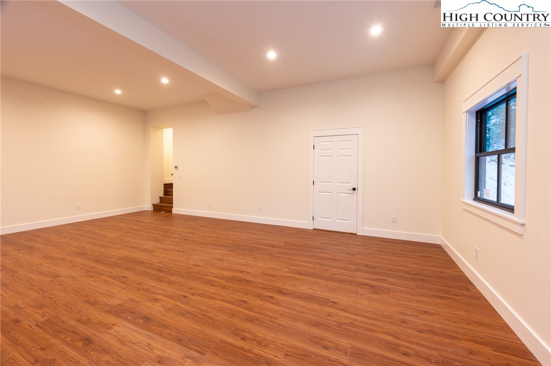 131 Bryce Way Boone, NC 28607 - Photo 25 of 38 an empty room with wooden floor and windows