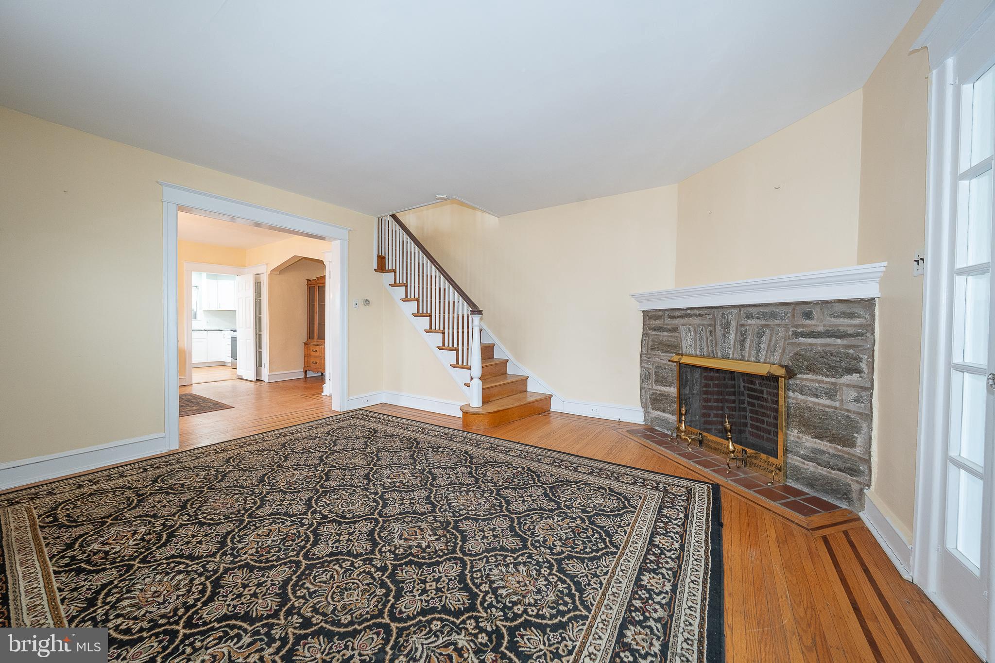 500 Elm Avenue Upper Darby, PA 19082 - Photo 12 of 35 a view of an empty room with wooden floor and a fireplace