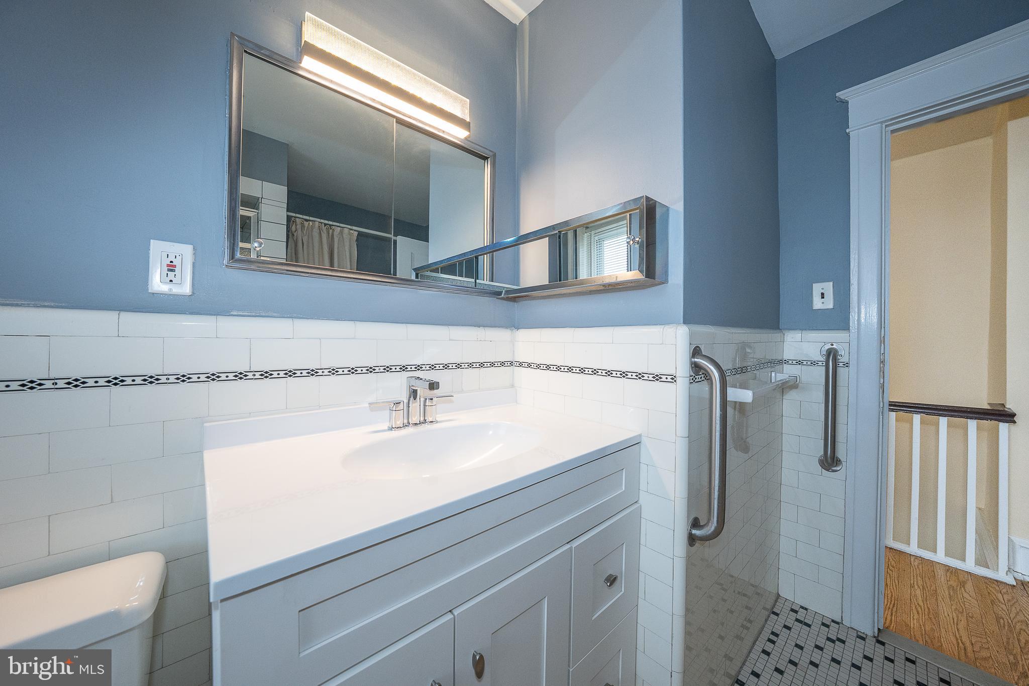 500 Elm Avenue Upper Darby, PA 19082 - Photo 22 of 35 a bathroom with a sink and a mirror