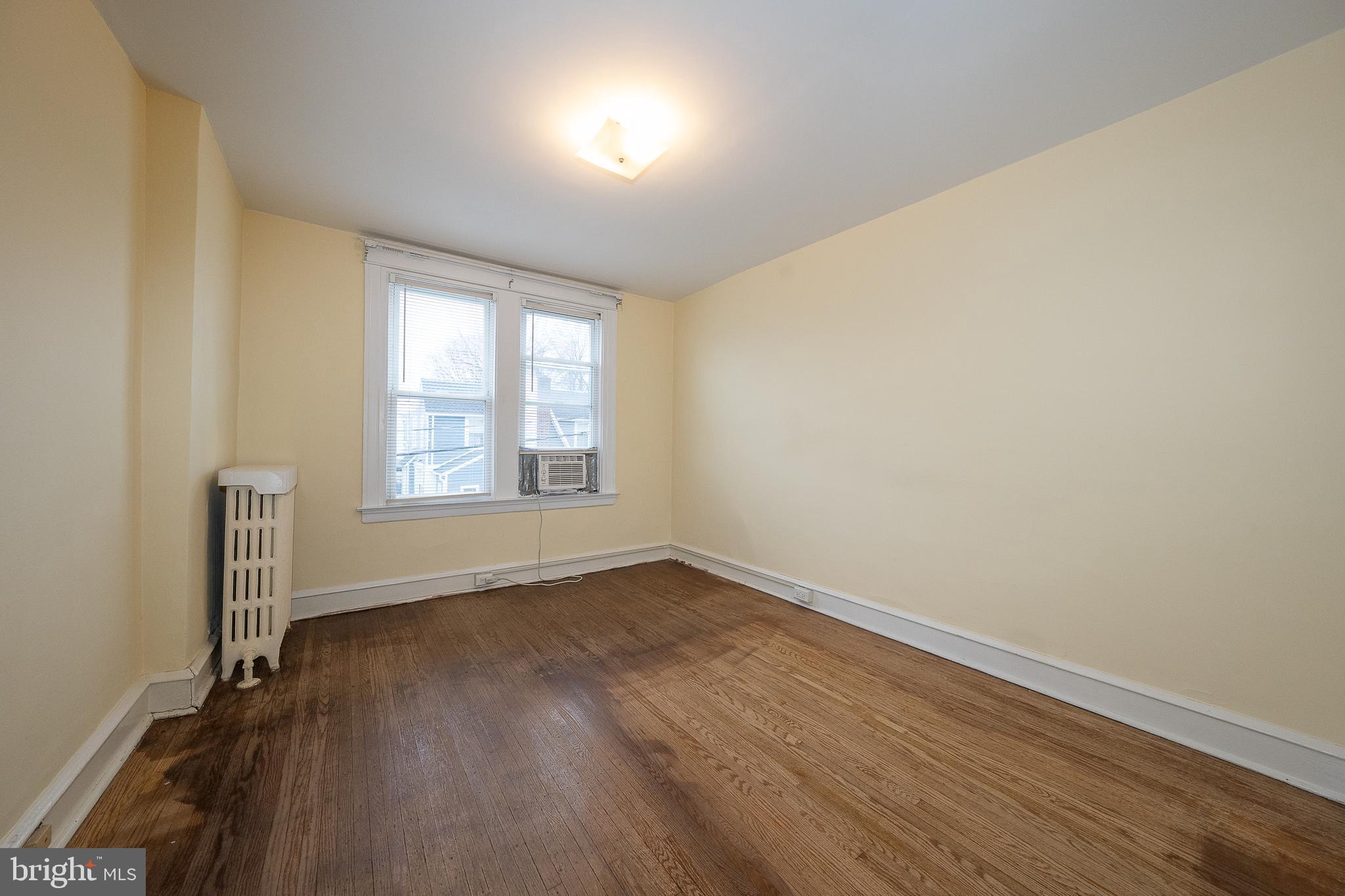500 Elm Avenue Upper Darby, PA 19082 - Photo 23 of 35 an empty room with wooden floor and windows