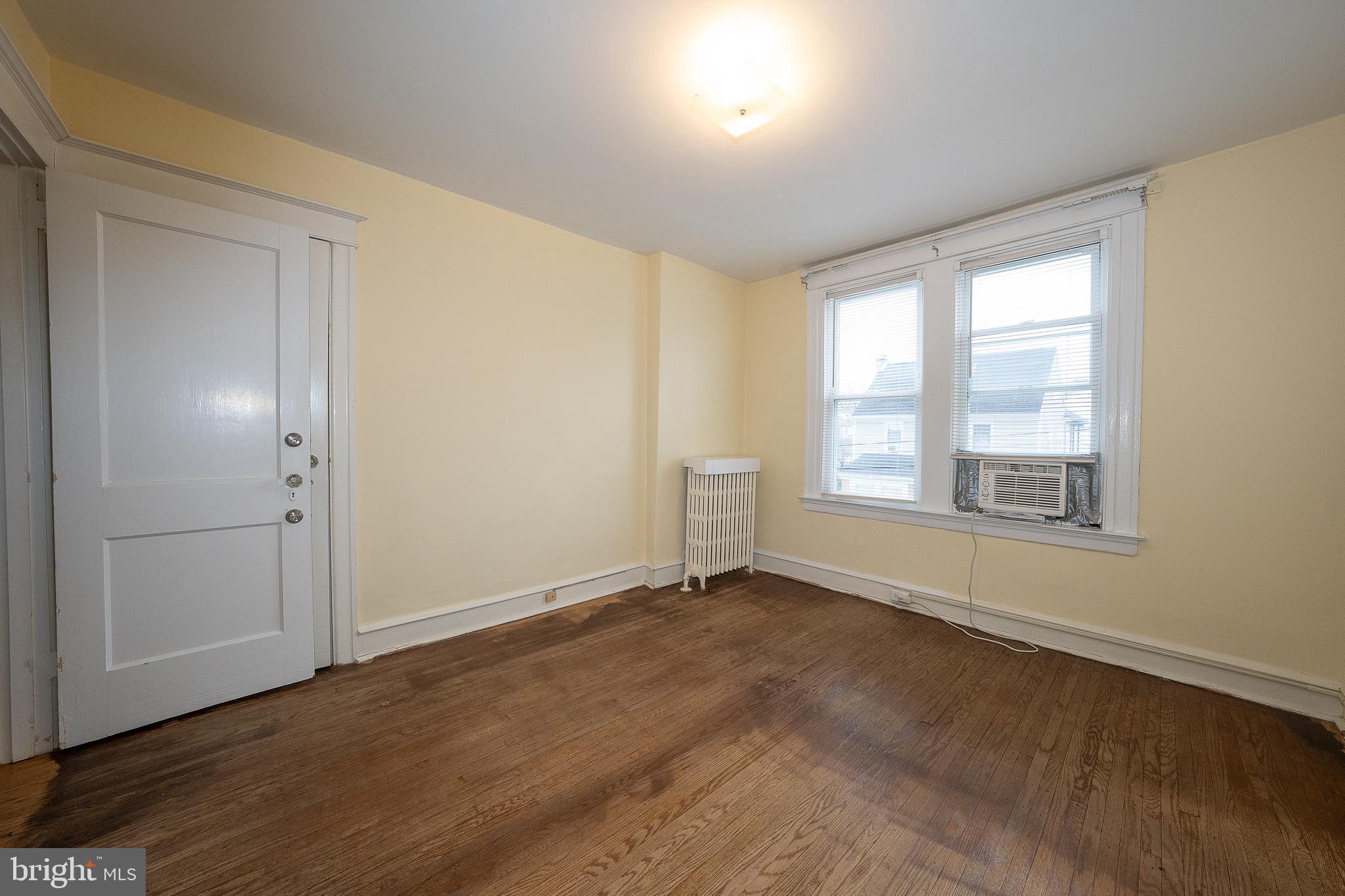 500 Elm Avenue Upper Darby, PA 19082 - Photo 24 of 35 a view of an empty room with wooden floor and a window