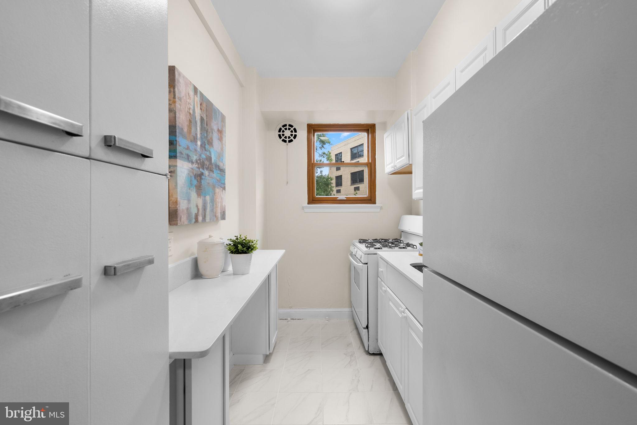3025 Ontario Road Northwest, Unit 407 Washington, DC 20009 - Photo 16 of 28 Bright and airy kitchen space.