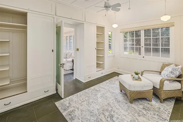 a spacious bedroom with a bed and wooden floor