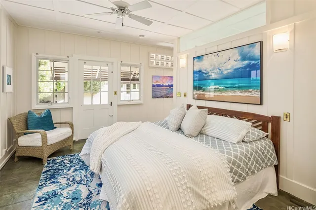 a bedroom with a bed and glass walk in closet