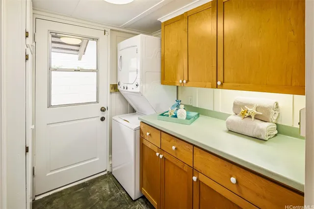 a bathroom with a granite countertop sink and a window