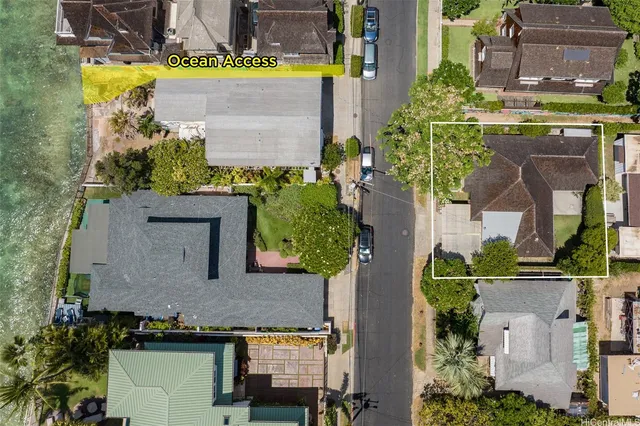 an aerial view of a house with a swimming pool