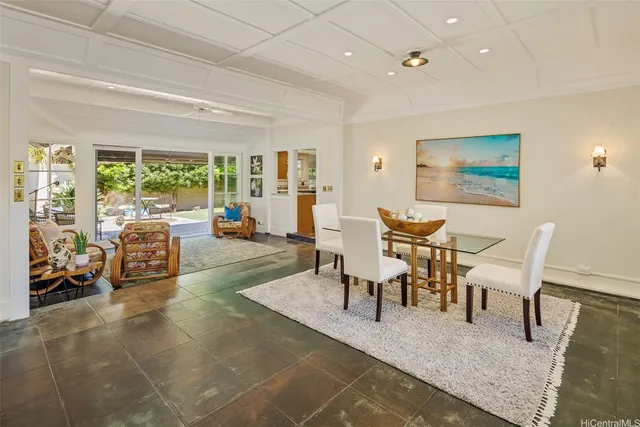 a living room with furniture and large windows