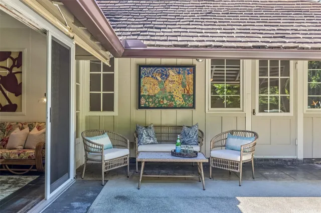 a outdoor living space with furniture and a window