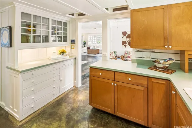 a kitchen with sink cabinets and window
