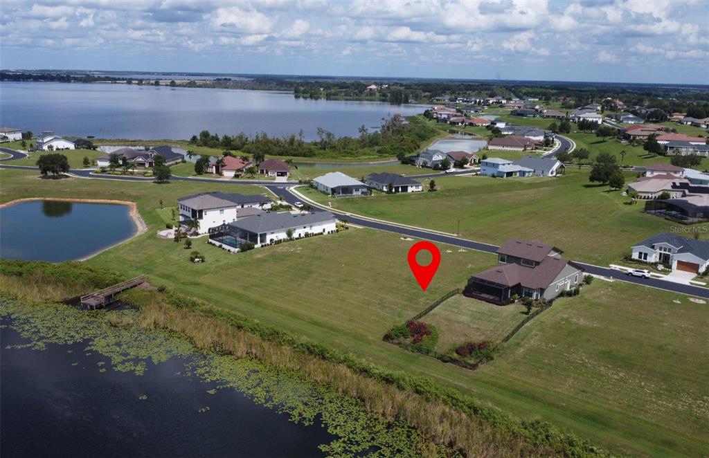 204 Valencia Ridge Drive Auburndale, FL 33823 - Photo 2 of 34 an aerial view of a houses with a lake