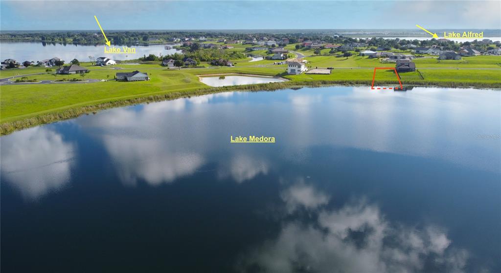 204 Valencia Ridge Drive Auburndale, FL 33823 - Photo 5 of 34 a view of a lake with a houses