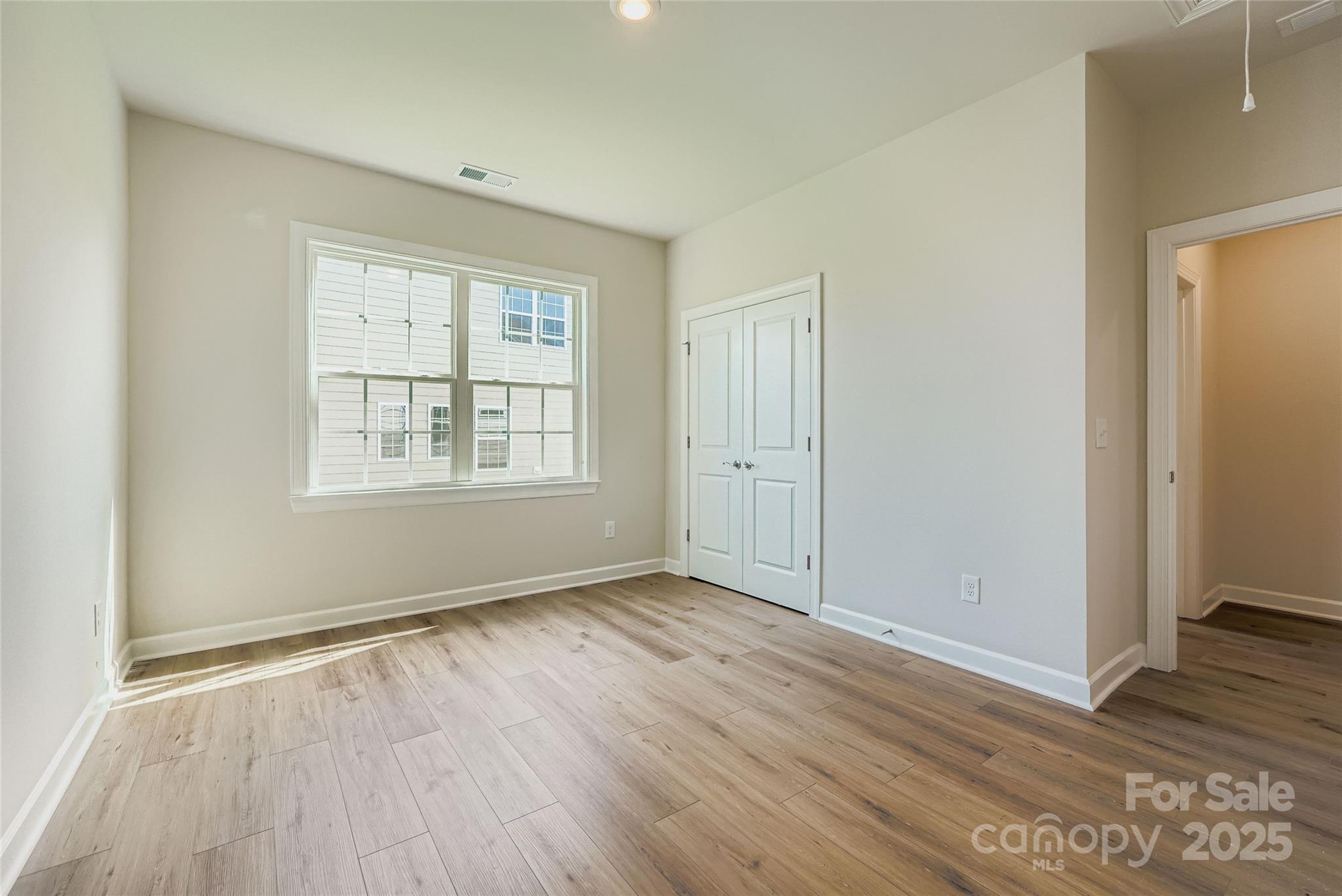 2244 Moon Crst Road Lancaster, SC 29720 - Photo 11 of 17 an empty room with wooden floor and windows