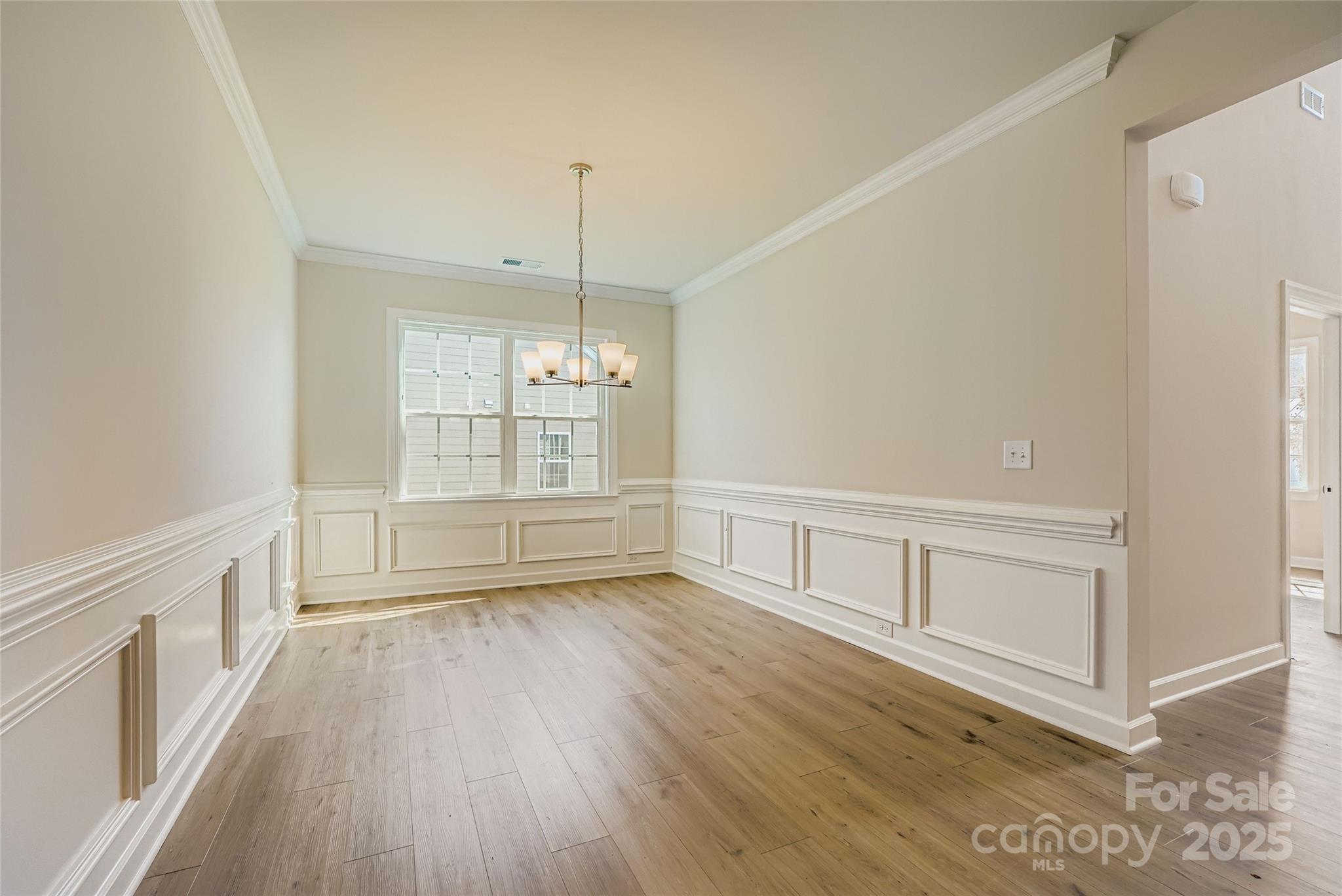 2244 Moon Crst Road Lancaster, SC 29720 - Photo 5 of 17 a view of an empty room with wooden floor and a window