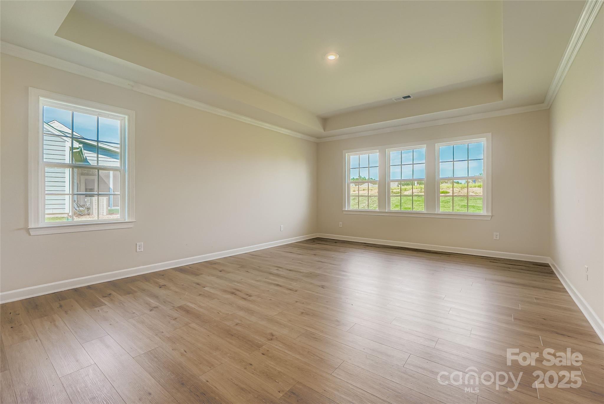 2244 Moon Crst Road Lancaster, SC 29720 - Photo 7 of 17 an empty room with wooden floor and windows