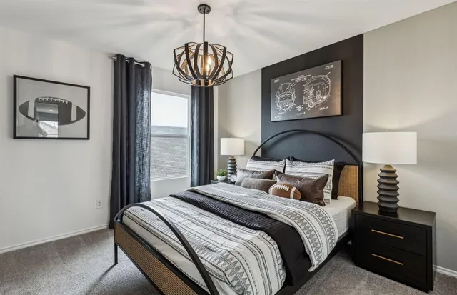 a bedroom with a large bed and a window