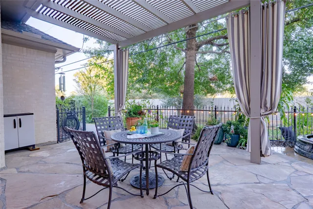 a view of a patio with a table chairs and a table