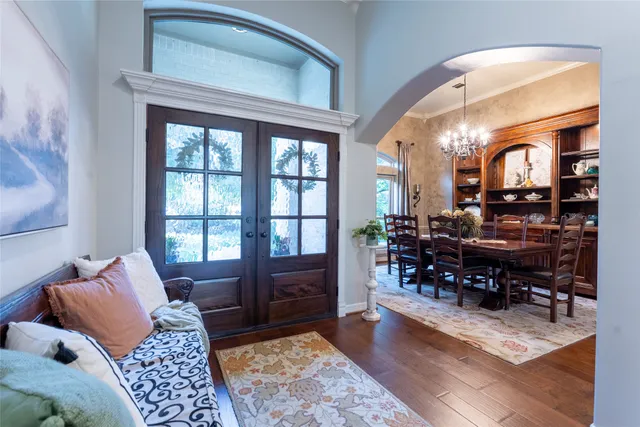 a bedroom with furniture and wooden floor