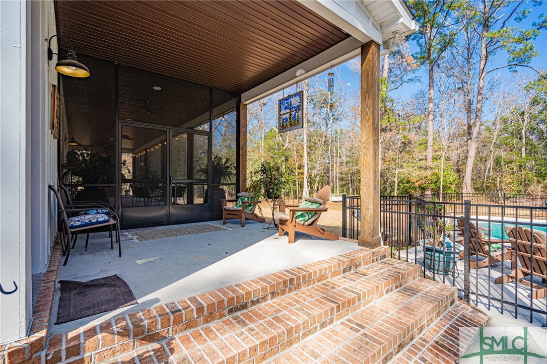 157 Ackerman Road Rincon, GA 31326 - Photo 33 of 50 Side porch to Back Porch and Mudroom