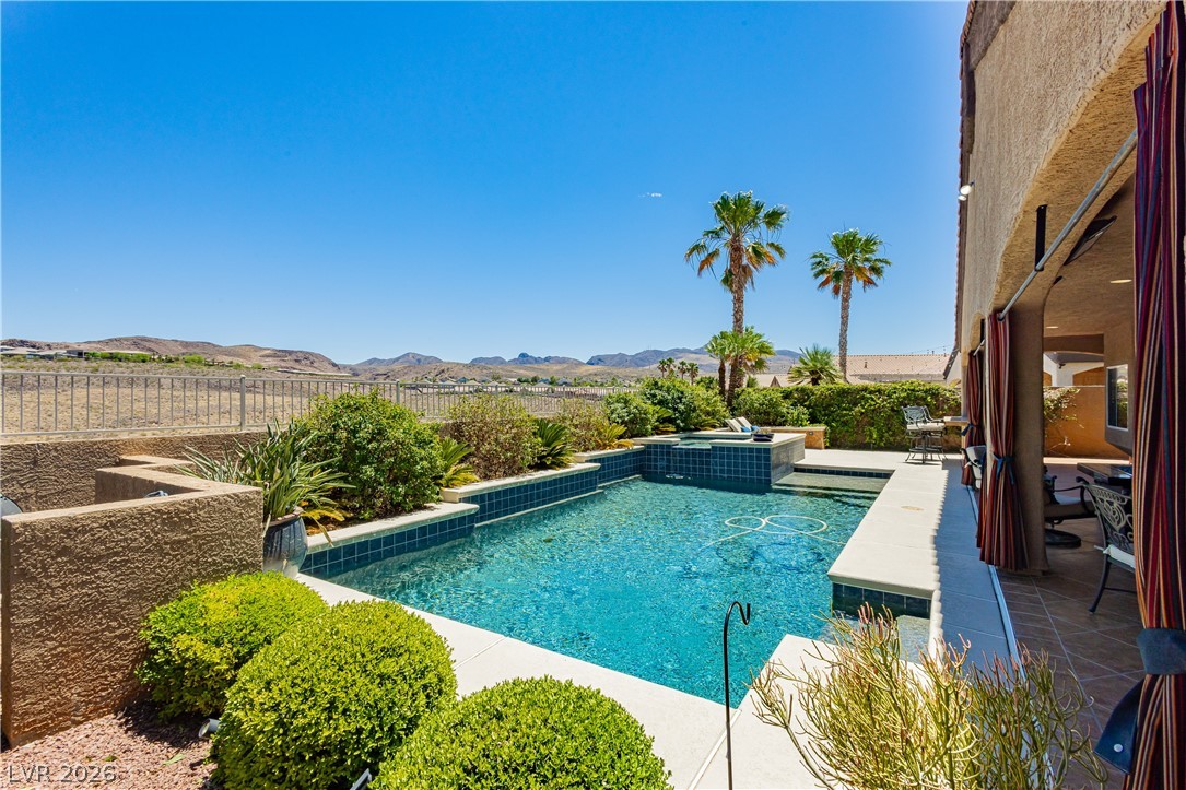 2256 Dogwood Ranch Avenue Henderson, NV 89052 - Photo 45 of 51 A sparkling pool and spa offer refreshing desert-view leisure.