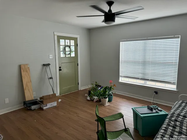 a view of a livingroom with furniture and a window