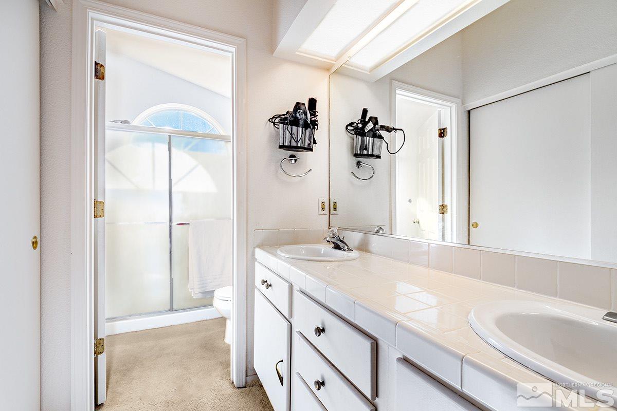 2805 Alpine Creek Road Reno, NV 89519 - Photo 13 of 21 a bathroom with a sink and a mirror