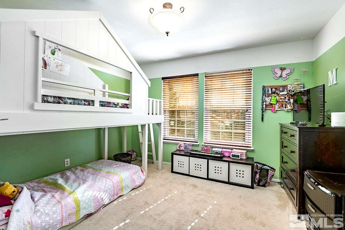 2805 Alpine Creek Road Reno, NV 89519 - Photo 14 of 21 a bedroom with furniture and a flat screen tv