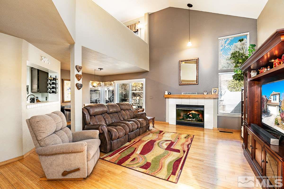 2805 Alpine Creek Road Reno, NV 89519 - Photo 2 of 21 a living room with furniture fireplace and flat screen tv
