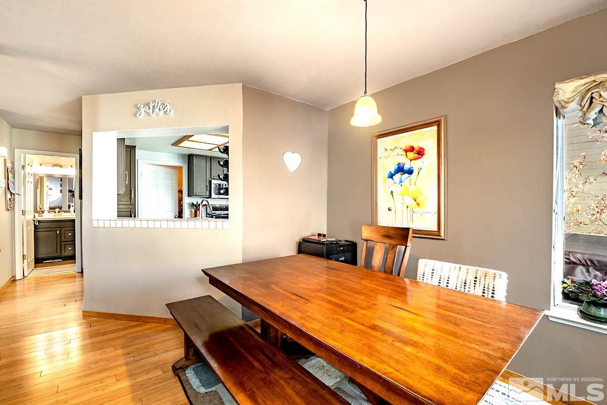 2805 Alpine Creek Road Reno, NV 89519 - Photo 4 of 21 a view of a dining room with furniture and wooden floor