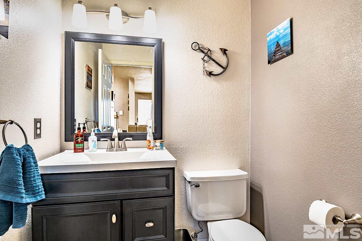 2805 Alpine Creek Road Reno, NV 89519 - Photo 9 of 21 a bathroom with a sink vanity mirror and toilet