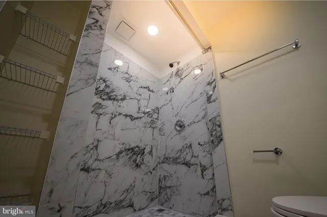 a utility room with cabinets washer and dryer