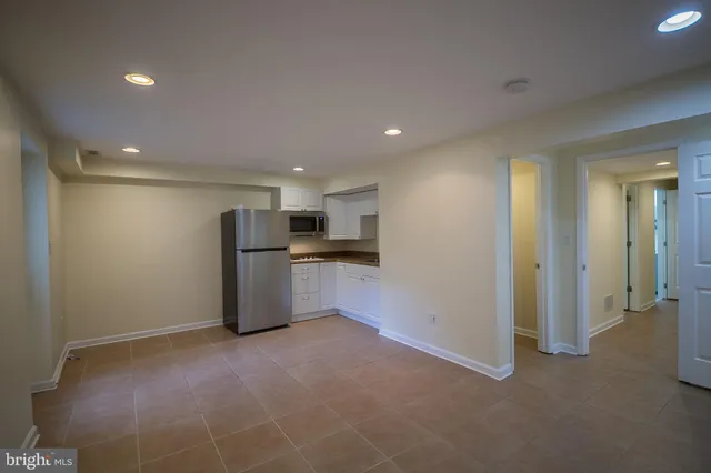 a view of a kitchen with a refrigerator