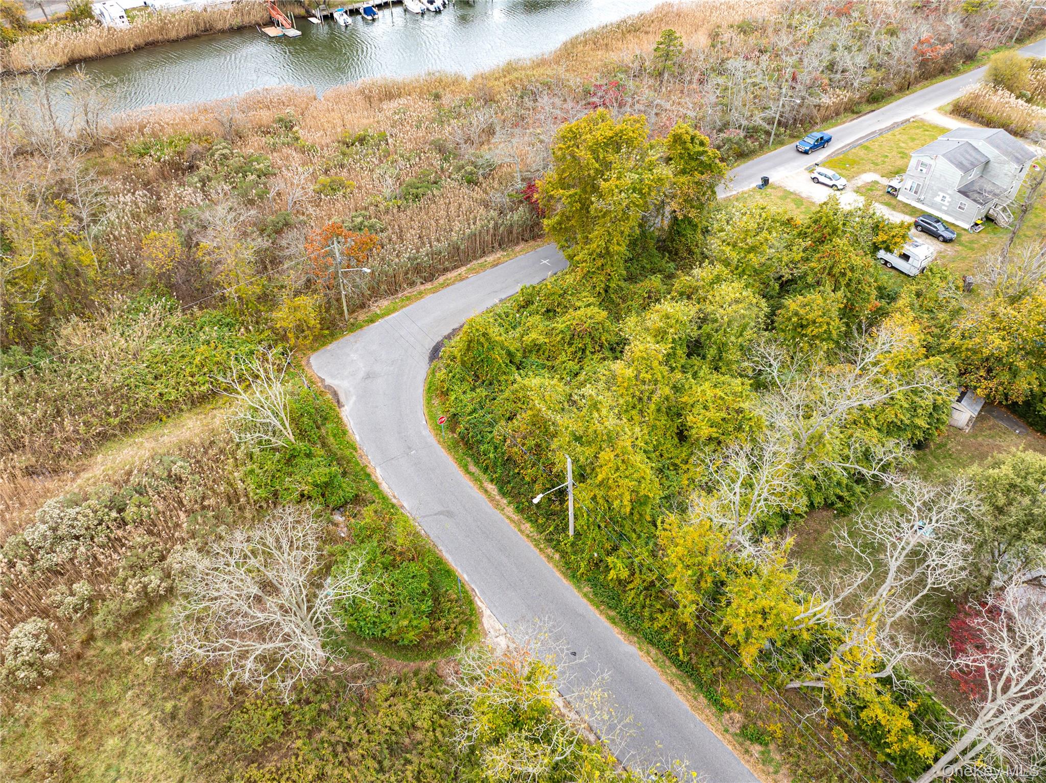 West Riviera Drive Mastic Beach, NY 11951 - Photo 3 of 9 a view of a lake with a lake
