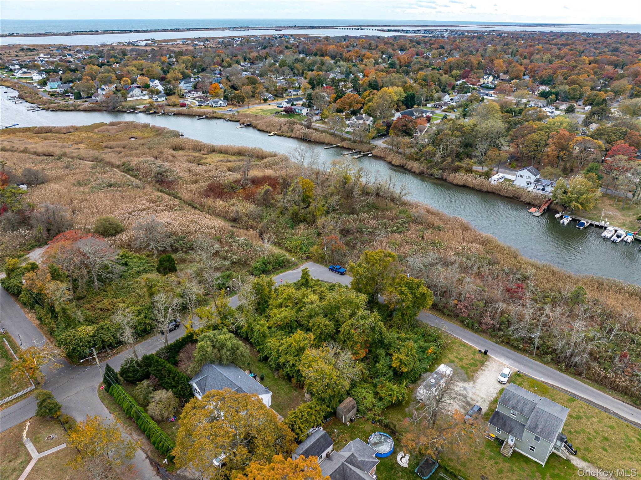 West Riviera Drive Mastic Beach, NY 11951 - Photo 8 of 9 an aerial view of residential houses with outdoor space