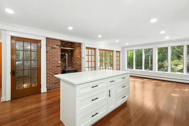 a room with natural light and hardwood