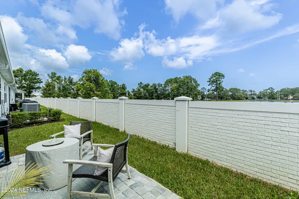 a view of a house with a yard patio and swimming pool