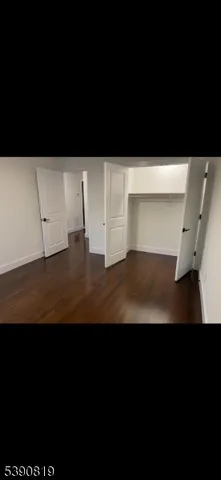 a view of wooden floor and a window