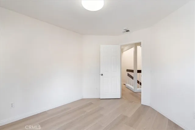 a bathroom with a granite countertop sink toilet a mirror and shower