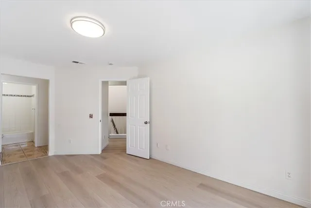 a bathroom with a granite countertop sink a mirror and shower