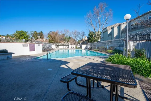 a roof deck with table and chairs
