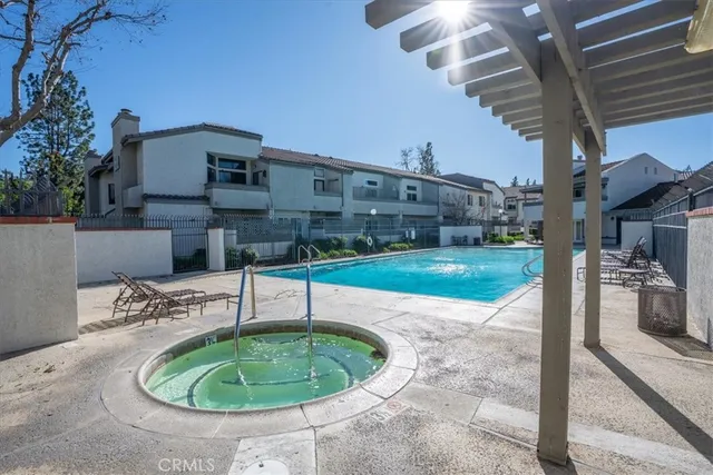 a view of a house with outdoor space and sitting area