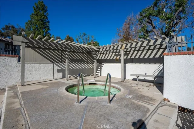 a view of a swimming pool and a yard