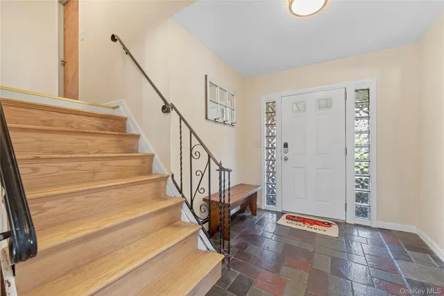 a view of entryway with wooden floor