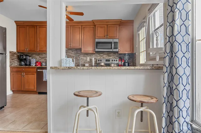 a kitchen with stainless steel appliances a sink and a stove