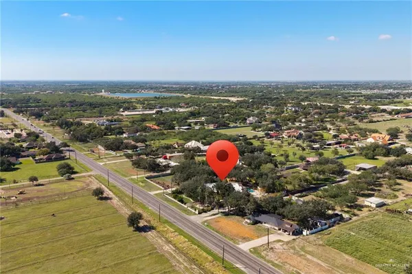 an aerial view of a city with a lake