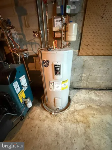 a front view of house with yard and trees around