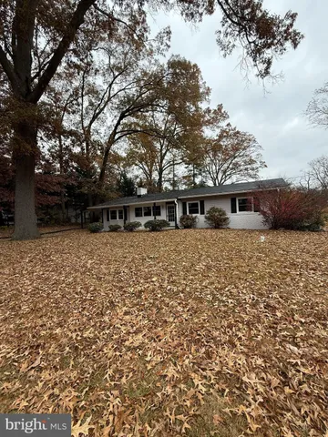 a front view of house with yard outdoor seating and barbeque oven