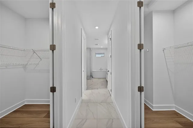 a bathroom with a granite countertop shower