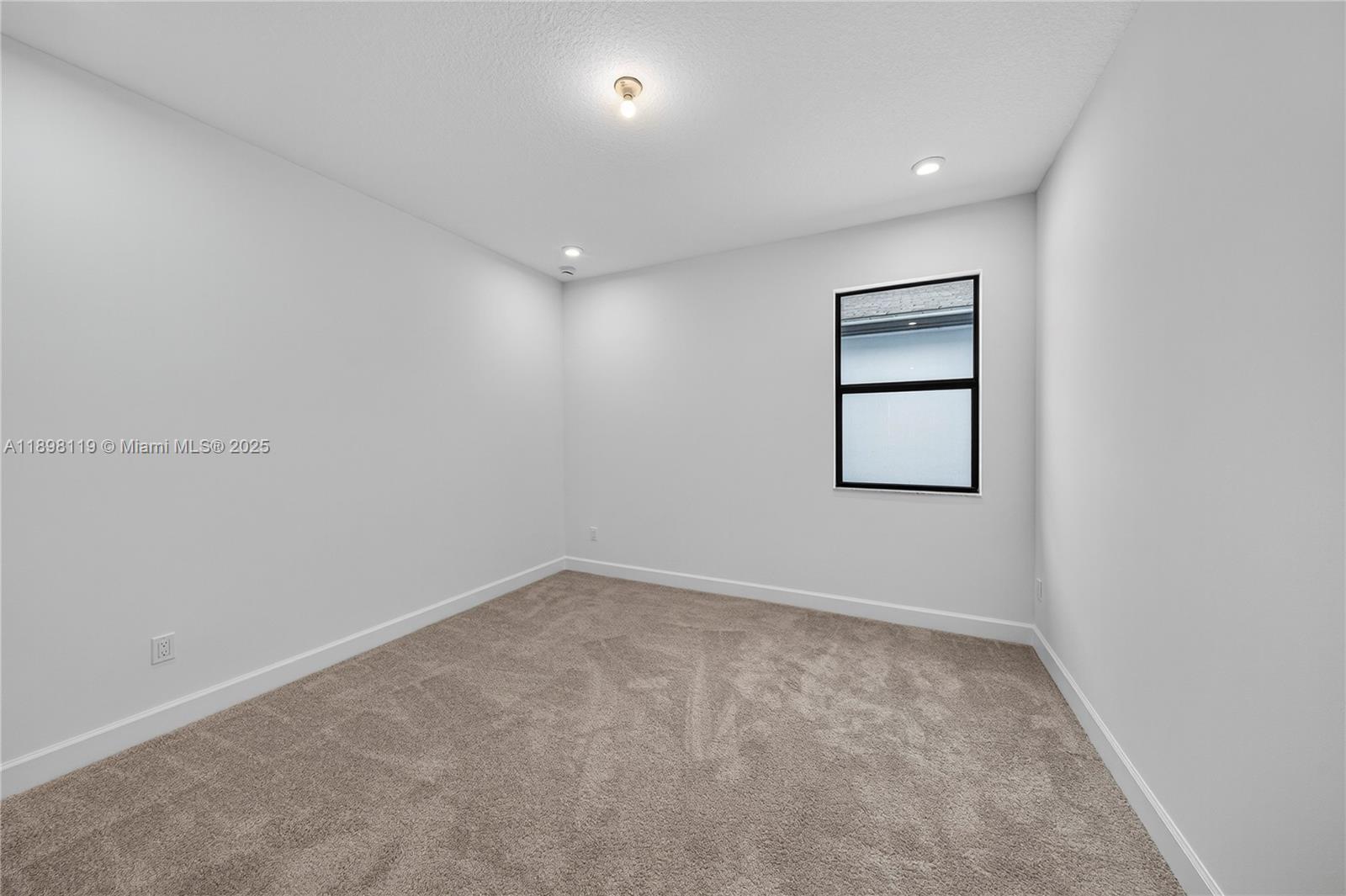 2722 Northwest 87th Terrace Cooper City, FL 33024 - Photo 21 of 44 an empty room with windows