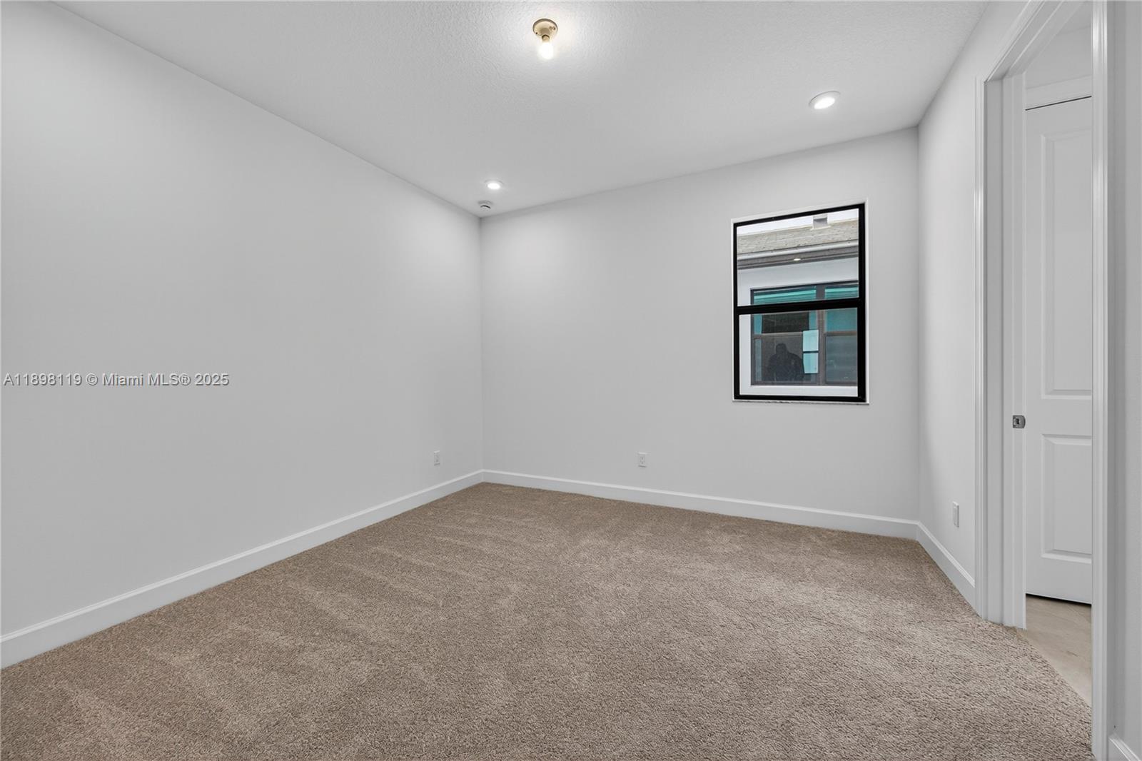 2722 Northwest 87th Terrace Cooper City, FL 33024 - Photo 29 of 44 an empty room with windows