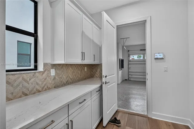 a kitchen with cabinets and a stove